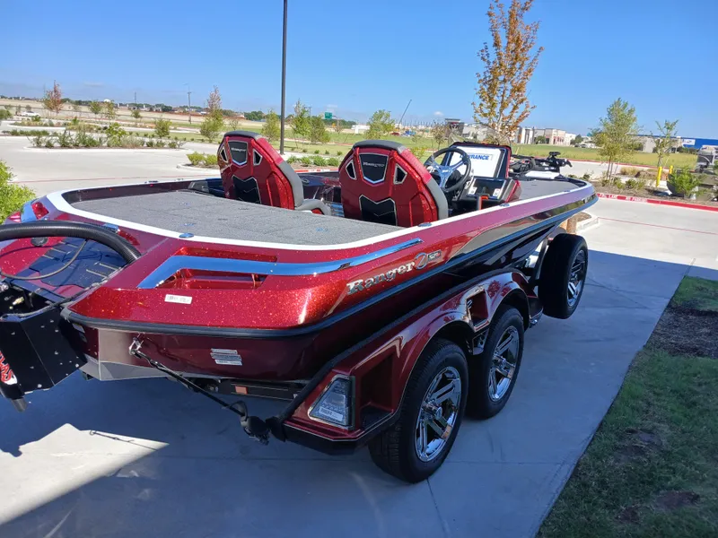 Slide: The Image of 2024 Ranger Z521R Ranger Cup Equipped boat, red exterior, parked outdoors. - 20