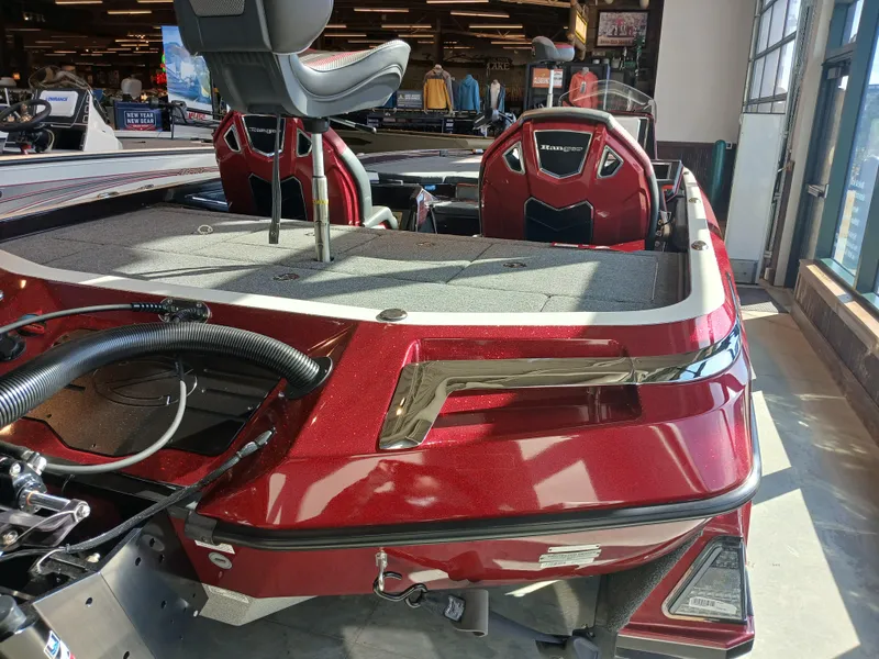 Slide: The Image of 2024 Ranger Z521R Ranger Cup Equipped boat, red exterior, interior seating, showroom display. - 23