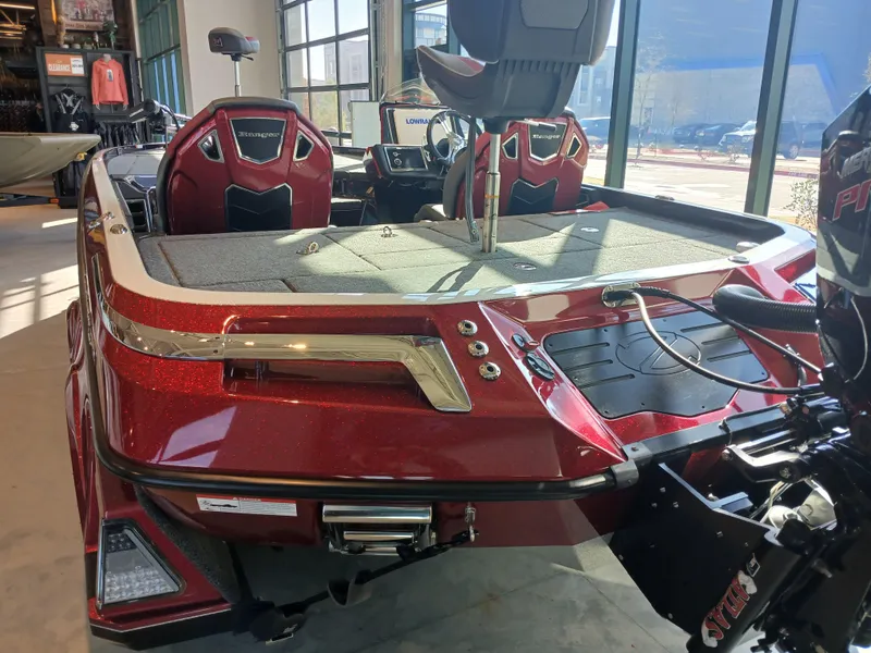 Slide: The Image of 2024 Ranger Z521R Ranger Cup Equipped boat, red exterior, displayed indoors. - 24