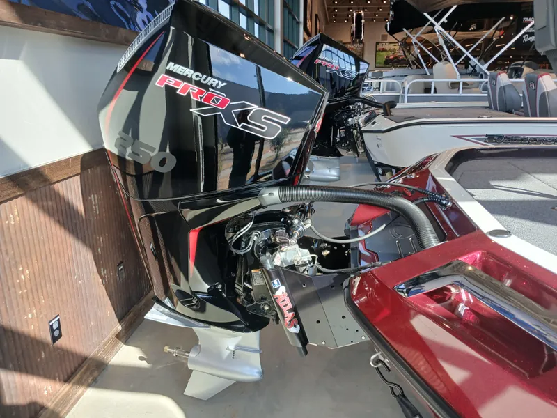 Slide: The Image of 2024 Ranger Z521R boat with Mercury Pro XS 250 engine, displayed indoors. - 25