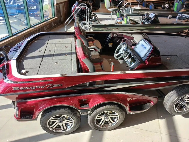 Slide: The Image of 2024 Ranger Z521R Ranger Cup Equipped boat, red and black, in showroom. - 7