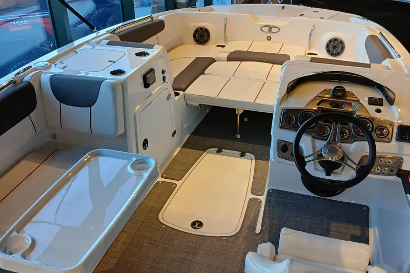 Slide: The Image of 2024 Tahoe 2150 boat interior with modern dashboard and spacious seating. - 2