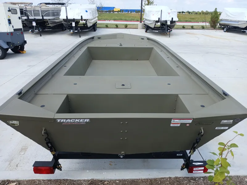 Slide: The Image of 2024 Tracker Grizzly 1754 Jon boat in outdoor showroom. - 3