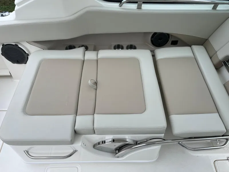 Slide: The Image of 2025 Boston Whaler 240 Vantage boat seating area with beige and white cushions. - 12