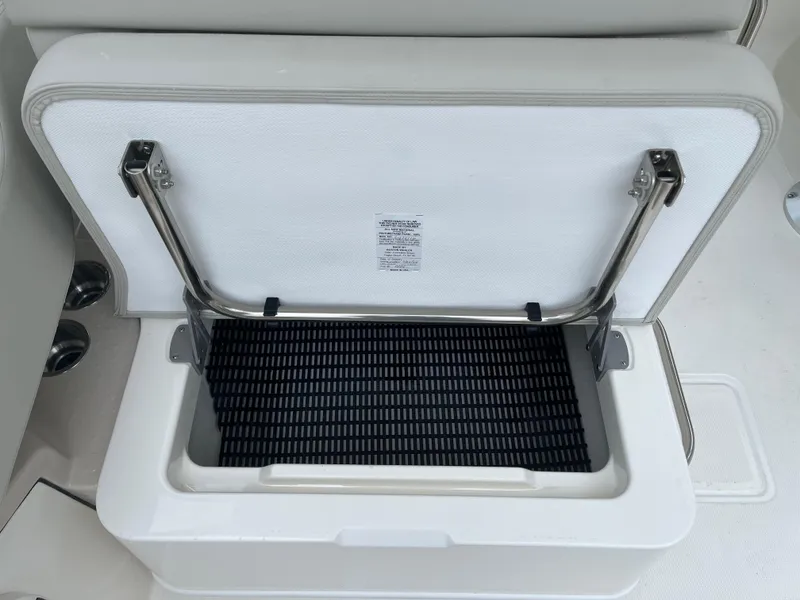 Slide: The Image of Open storage compartment on 2025 Boston Whaler 240 Vantage boat. - 13