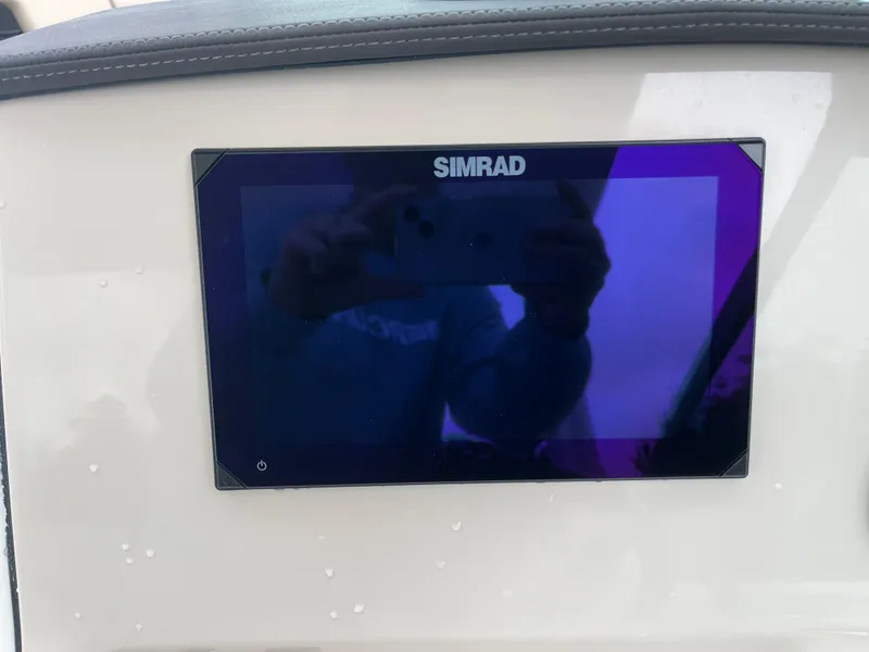 Slide: The Image of Simrad display on 2025 Boston Whaler 240 Vantage boat dashboard. - 17