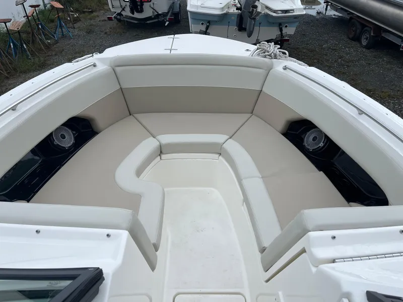 Slide: The Image of 2025 Boston Whaler 240 Vantage boat with spacious seating area and modern design. - 24