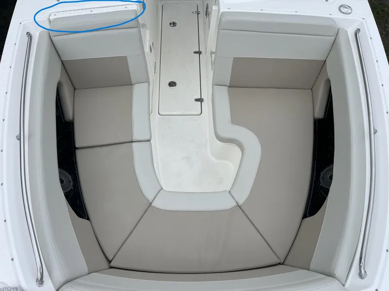 Slide: The Image of 2025 Boston Whaler 240 Vantage boat interior with cushioned seating and storage compartments. - 25