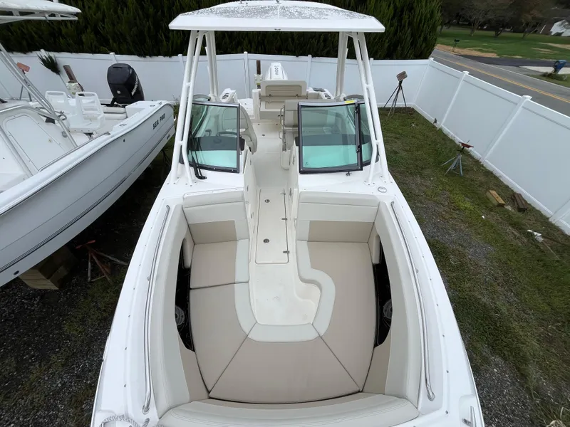 Slide: The Image of 2025 Boston Whaler 240 Vantage boat with spacious seating and sleek design. - 3