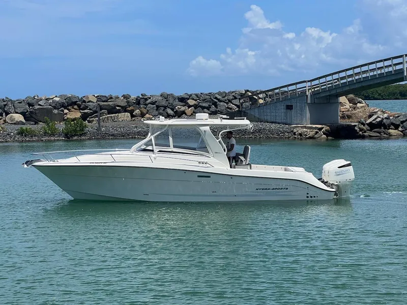 Slide: The Image of 2008 Hydra-Sports 3500VX boat cruising in a calm, scenic waterway. - 10