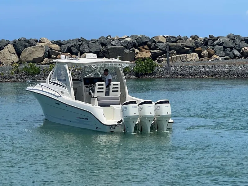 Slide: The Image of 2008 Hydra-Sports 3500VX boat with triple outboard engines on calm water. - 14