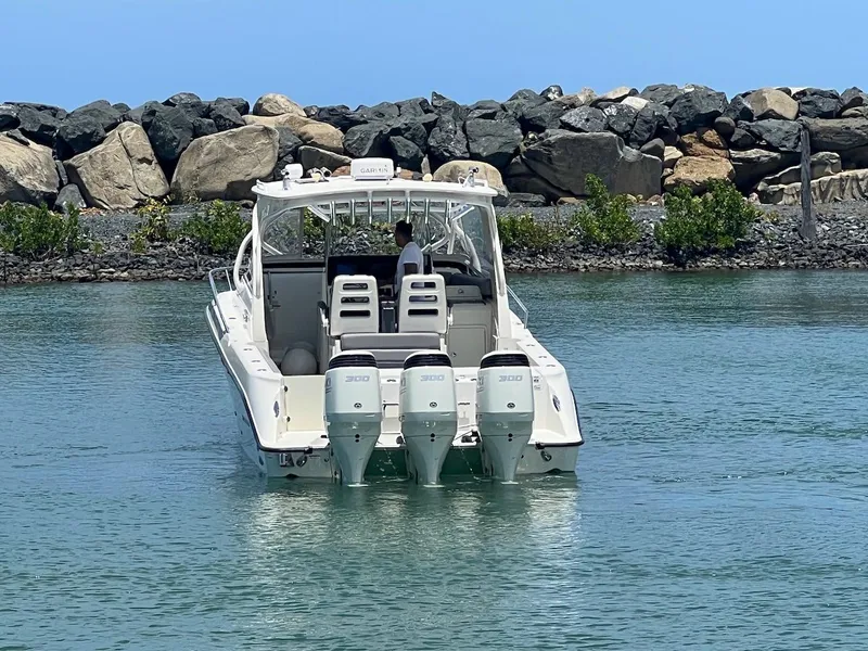 Slide: The Image of 2008 Hydra-Sports 3500VX boat with triple outboard engines on calm water. - 16