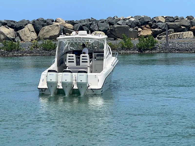 Slide: The Image of 2008 Hydra-Sports 3500VX boat with triple outboard engines on calm water. - 17