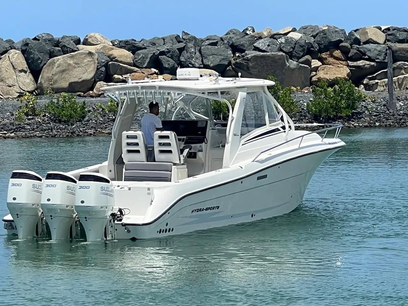 Slide: The Image of 2008 Hydra-Sports 3500VX boat with triple Suzuki outboard engines on calm water. - 18