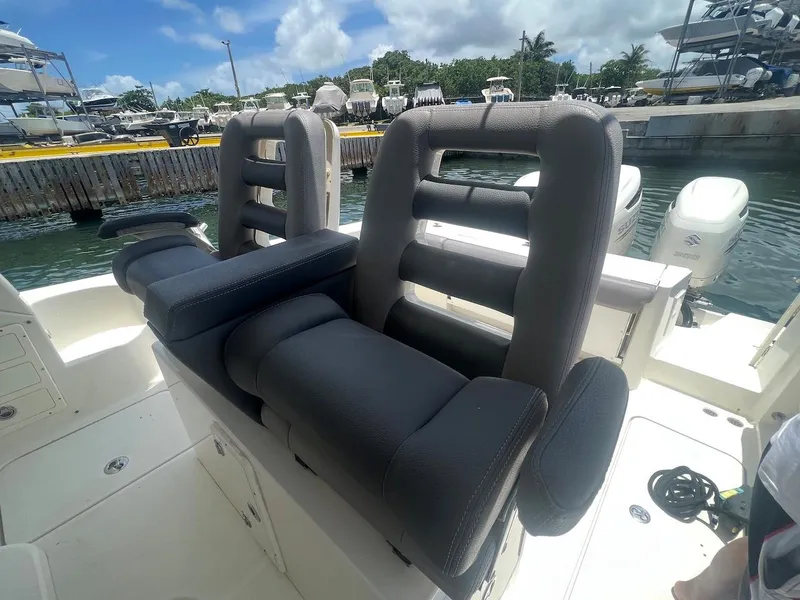 Slide: The Image of 2008 Hydra-Sports 3500VX boat with cushioned seating at the dock. - 23