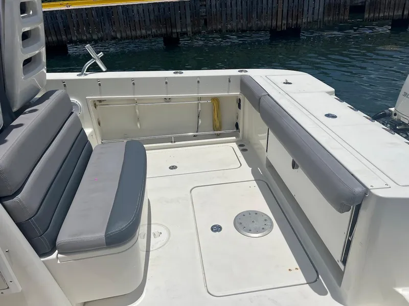 Slide: The Image of 2008 Hydra-Sports 3500VX boat interior with cushioned seating and storage compartments. - 24