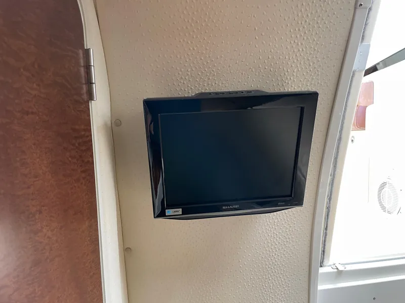 Slide: The Image of Wall-mounted TV inside 2008 Hydra-Sports 3500VX boat cabin. - 30