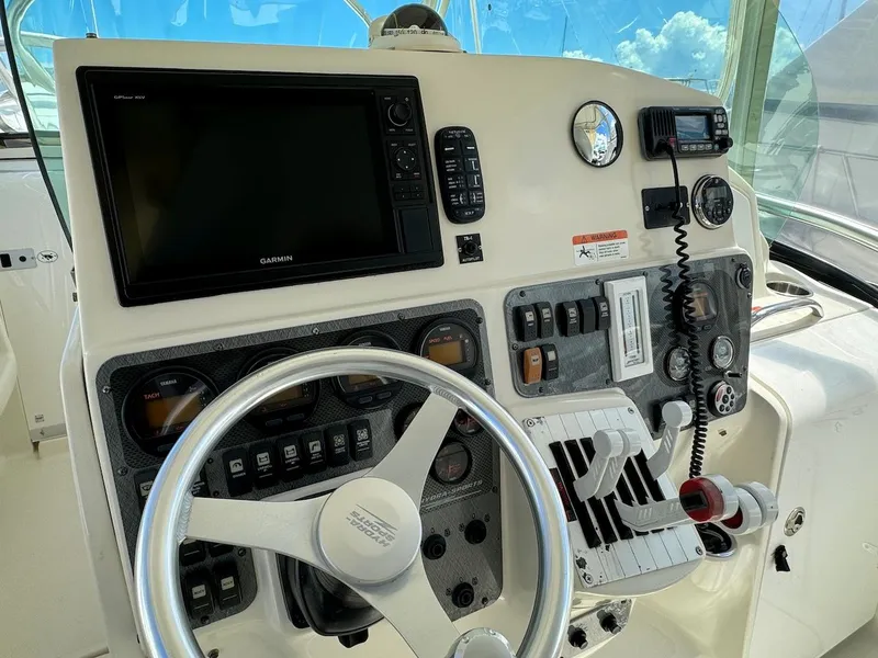 Slide: The Image of 2006 Hydra-Sports 3300 VX boat helm with Garmin navigation system and control panel. - 5