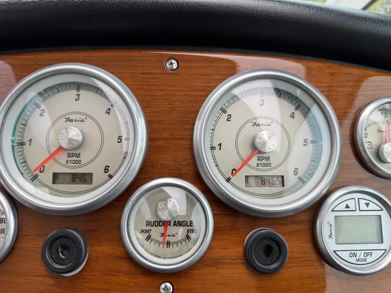 Slide: The Image of Dashboard of 2006 Cruisers Yachts 420 Express with RPM and rudder angle gauges. - 15