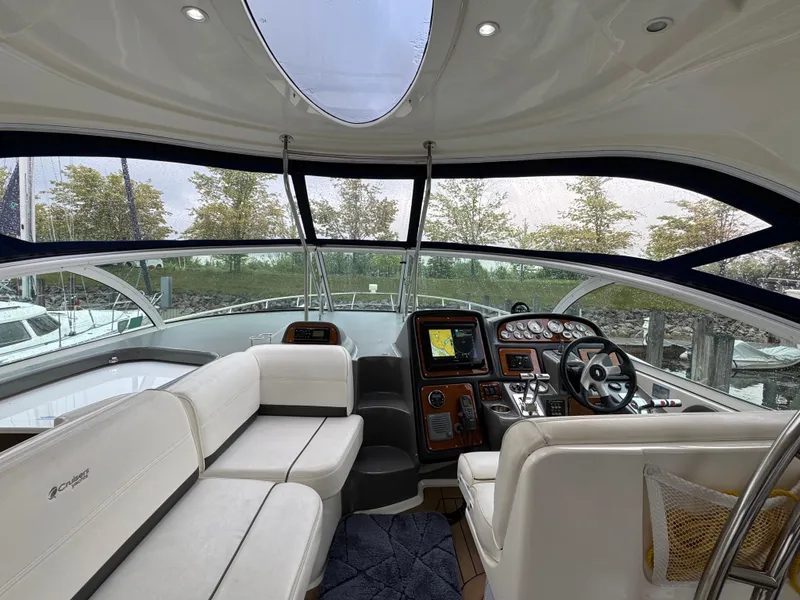 Slide: The Image of Interior of 2006 Cruisers Yachts 420 Express with modern helm and seating area. - 16