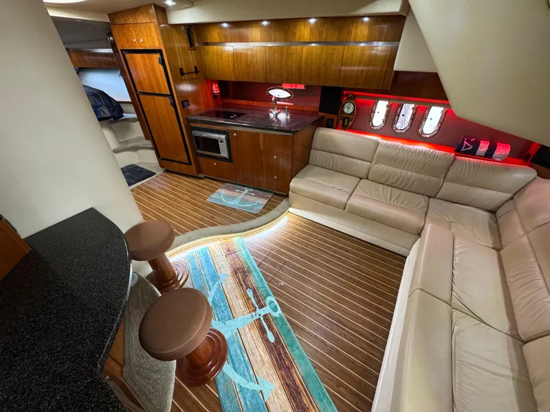 Slide: The Image of Luxurious interior of 2006 Cruisers Yachts 420 Express with modern kitchen and comfortable seating. - 20