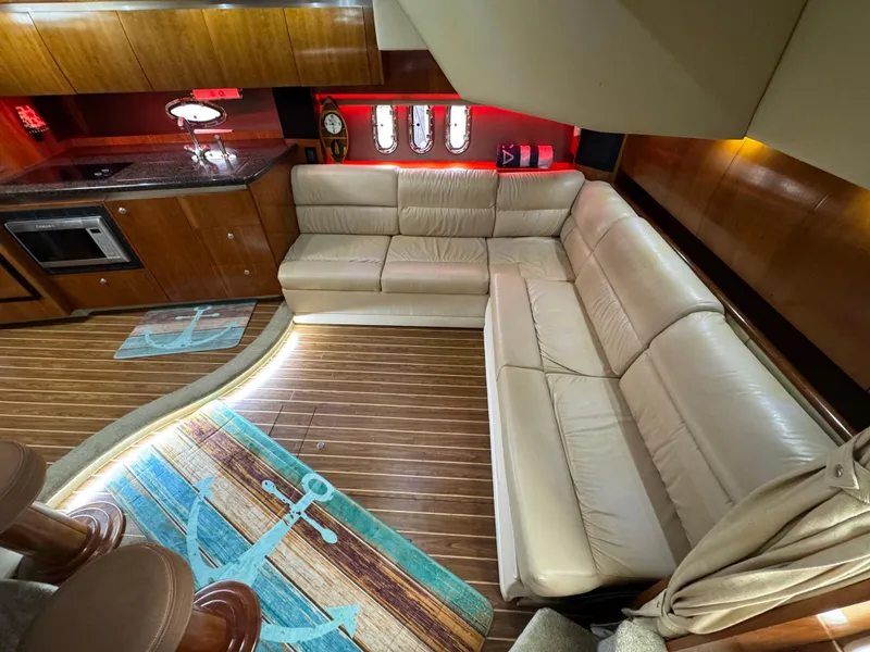 Slide: The Image of Luxurious interior of 2006 Cruisers Yachts 420 Express with leather seating and wood flooring. - 21