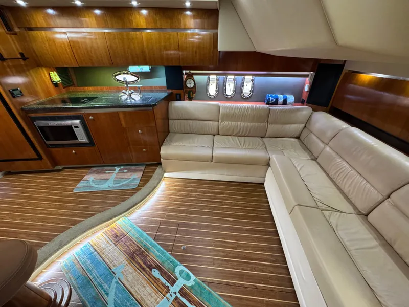 Slide: The Image of Luxurious interior of 2006 Cruisers Yachts 420 Express with leather seating and modern kitchen. - 24