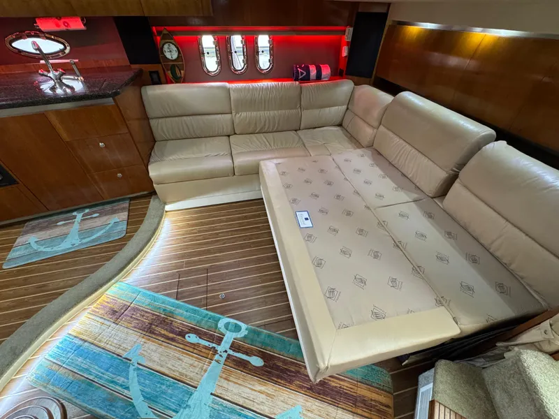 Slide: The Image of Luxurious interior of 2006 Cruisers Yachts 420 Express with beige leather seating and nautical decor. - 28
