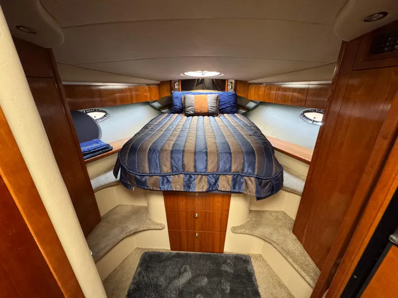 Slide: The Image of Luxurious cabin interior of 2006 Cruisers Yachts 420 Express with elegant bedding. - 29