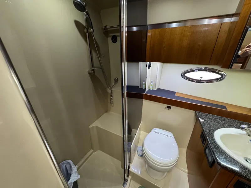 Slide: The Image of Luxurious bathroom in 2006 Cruisers Yachts 420 Express with shower, toilet, and sink. - 32