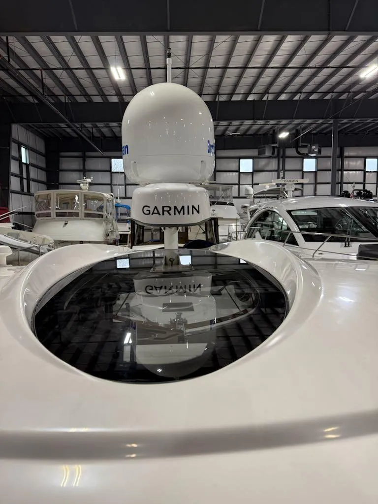 Slide: The Image of 2006 Cruisers Yachts 420 Express with Garmin radar in a showroom. - 37