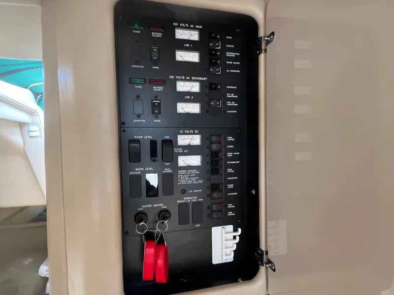 Slide: The Image of Electrical control panel of a 1998 Sea Ray 330 Sundancer boat. - 13