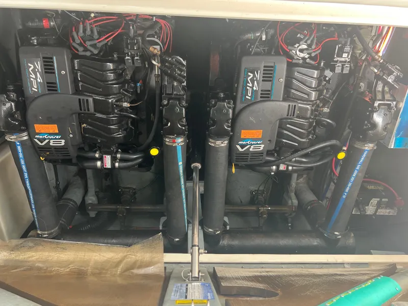 Slide: The Image of 1998 Sea Ray 330 Sundancer engine compartment with twin MerCruiser V8 engines. - 20