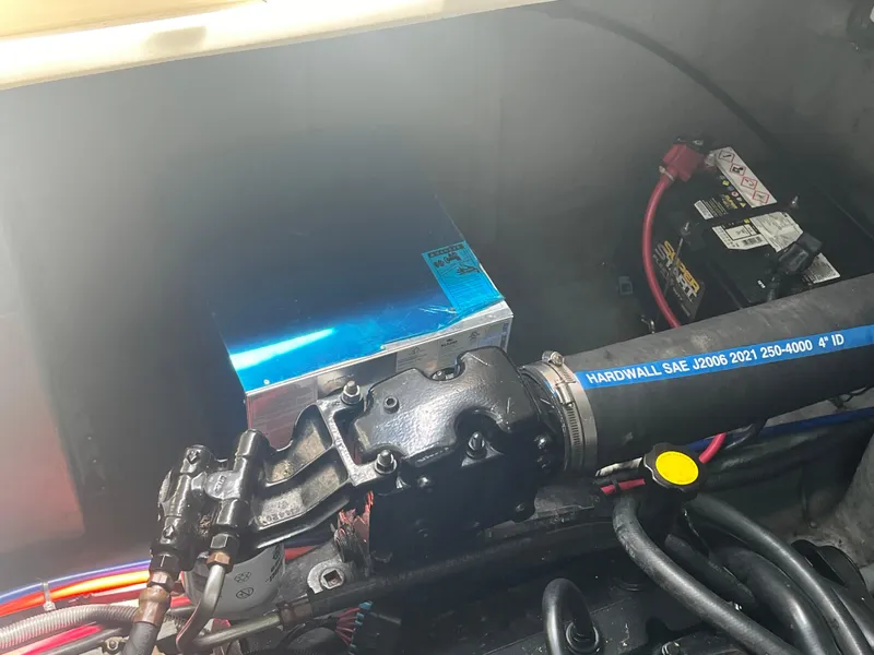 Slide: The Image of Engine compartment of a 1998 Sea Ray 330 Sundancer boat with battery and wiring. - 21
