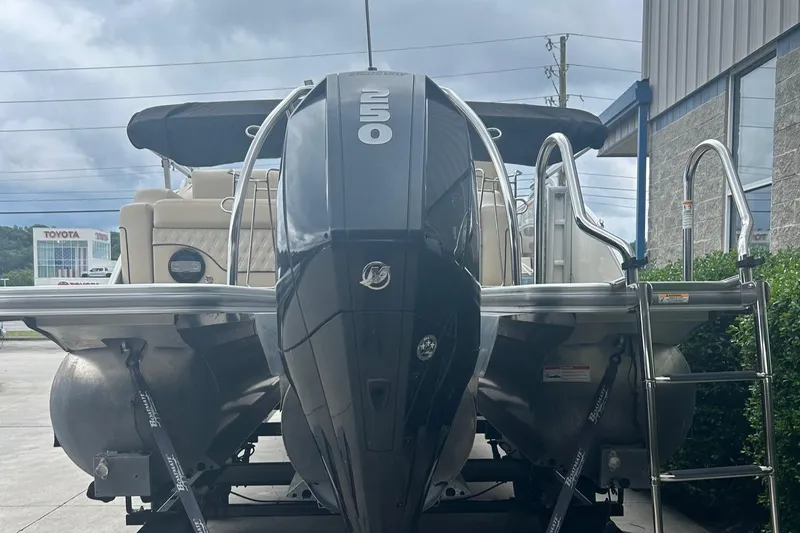 Slide: The Image of 2019 Barletta L25U pontoon boat with a 250 HP Mercury outboard engine. - 2