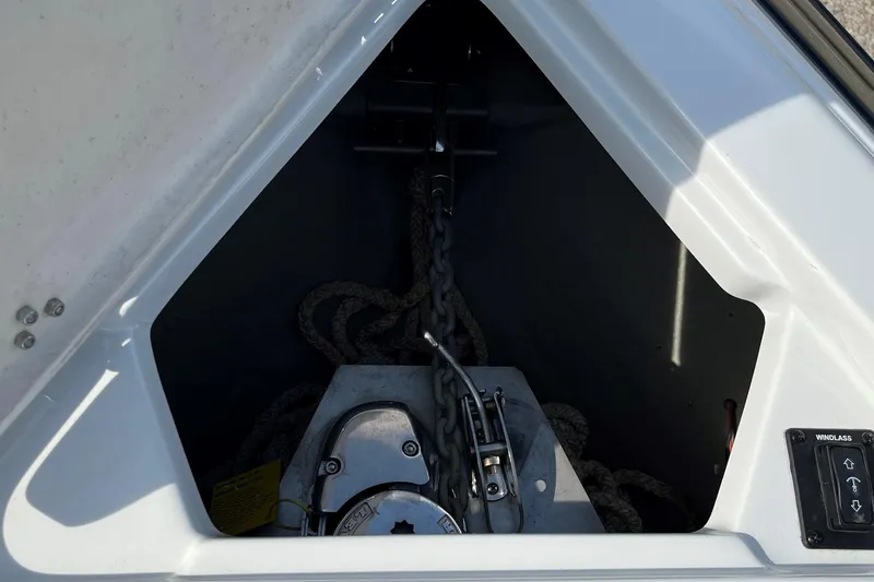 Slide: The Image of Anchor compartment of 2019 Crownline 265 SS SURF boat with winch and chain. - 4