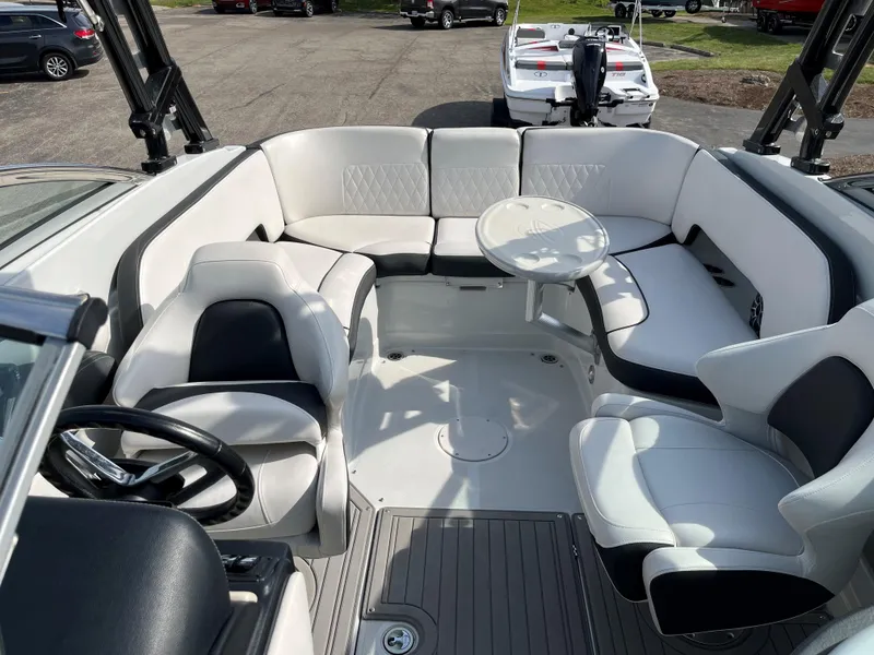 Slide: The Image of 2019 Crownline 265 SS SURF boat interior with white and black seating. - 6