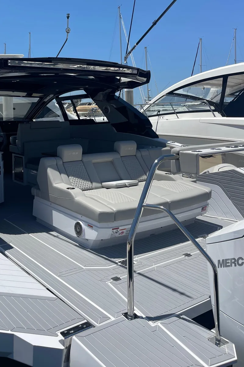 Slide: The Image of 2024 Cruisers Yachts 42GLS luxury boat with spacious deck and comfortable seating. - 4