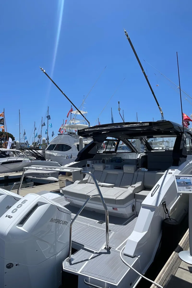 The Image of 2024 Cruisers Yachts 42GLS luxury boat docked at marina. - 1