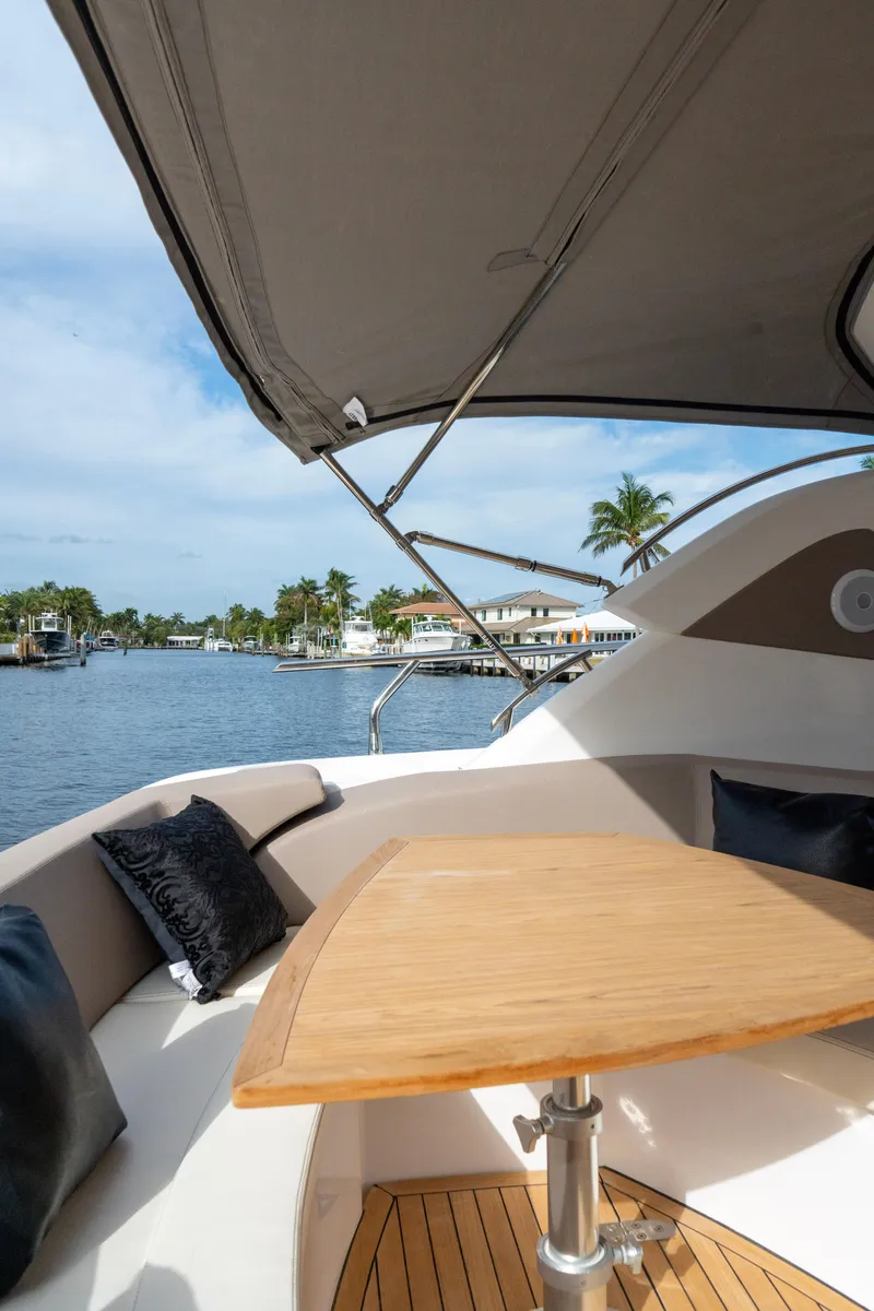 Slide: The Image of Luxurious bedroom in 2024 Sessa Marine C44 Cruiser with elegant decor and ambient lighting. - 14