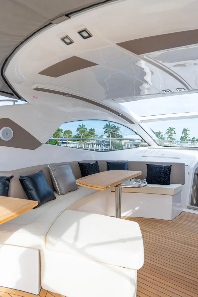 Slide: The Image of Luxurious cabin interior of 2024 Sessa Marine C44 Cruiser with cozy bedding and ambient lighting. - 19