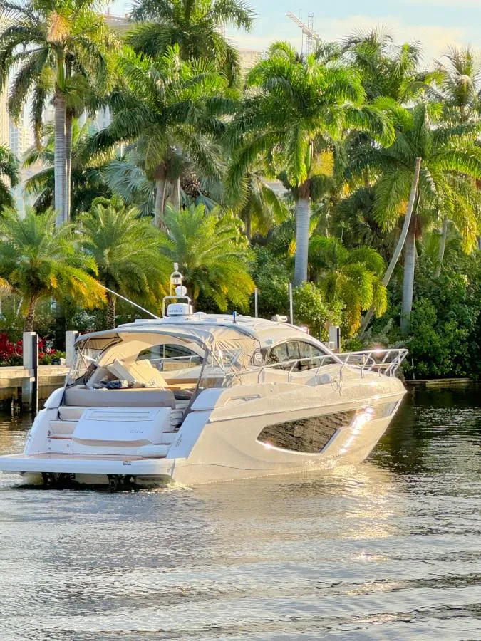 Slide: The Image of 2024 Sessa Marine C44 Cruiser with elegant seating and waterfront view. - 3