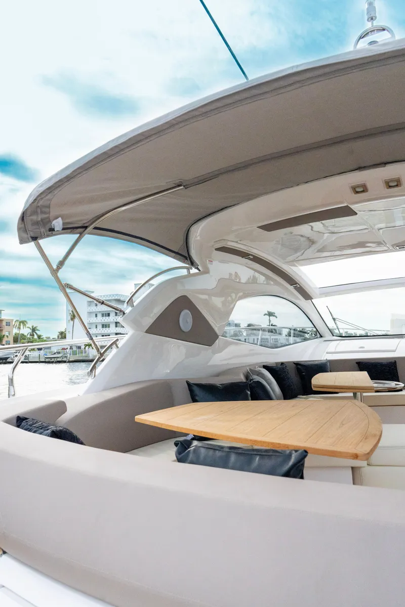 Slide: The Image of 2024 Sessa Marine C44 Cruiser with outdoor seating and grill area. - 5