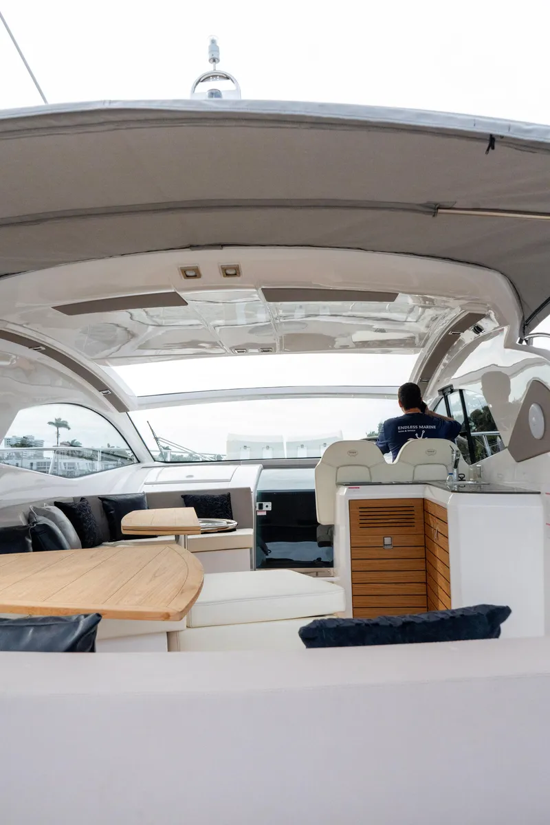 Slide: The Image of Luxurious interior of 2024 Sessa Marine C44 Cruiser with elegant seating and tables. - 8