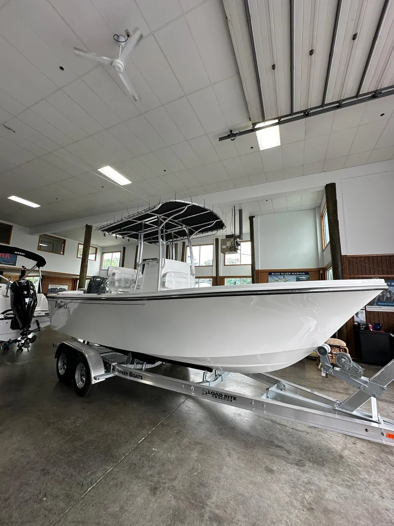 Slide: The Image of 2025 Parker 21SE Center Console boat on a trailer in a showroom. - 3