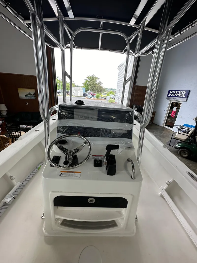 Slide: The Image of 2025 Parker 21SE Center Console boat interior with steering wheel and controls. - 6