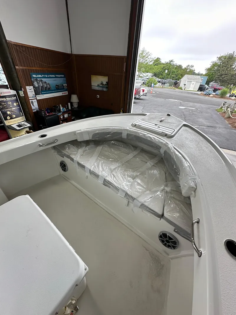 Slide: The Image of 2025 Parker 21SE Center Console boat interior in a storage facility. - 7