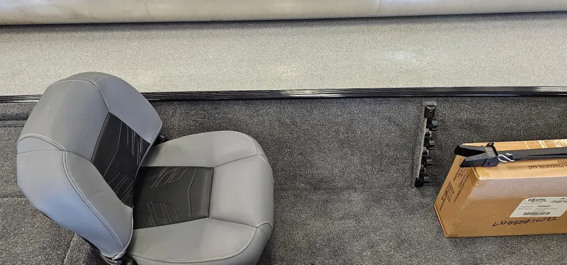 Slide: The Image of 2024 Tracker Bass Tracker Classic XL interior with seat and storage box. - 12