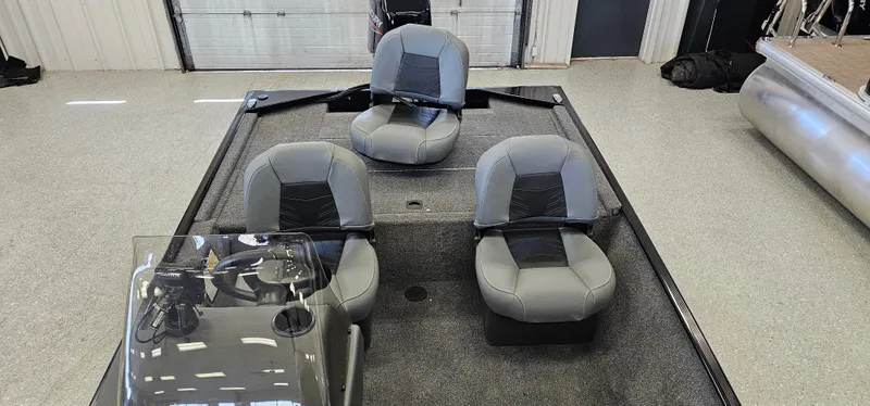 Slide: The Image of 2024 Tracker Bass Tracker Classic XL boat interior with three gray seats. - 5