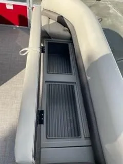 Slide: The Image of 2024 Sun Tracker Party Barge 18 DLX storage compartment under seat. - 15